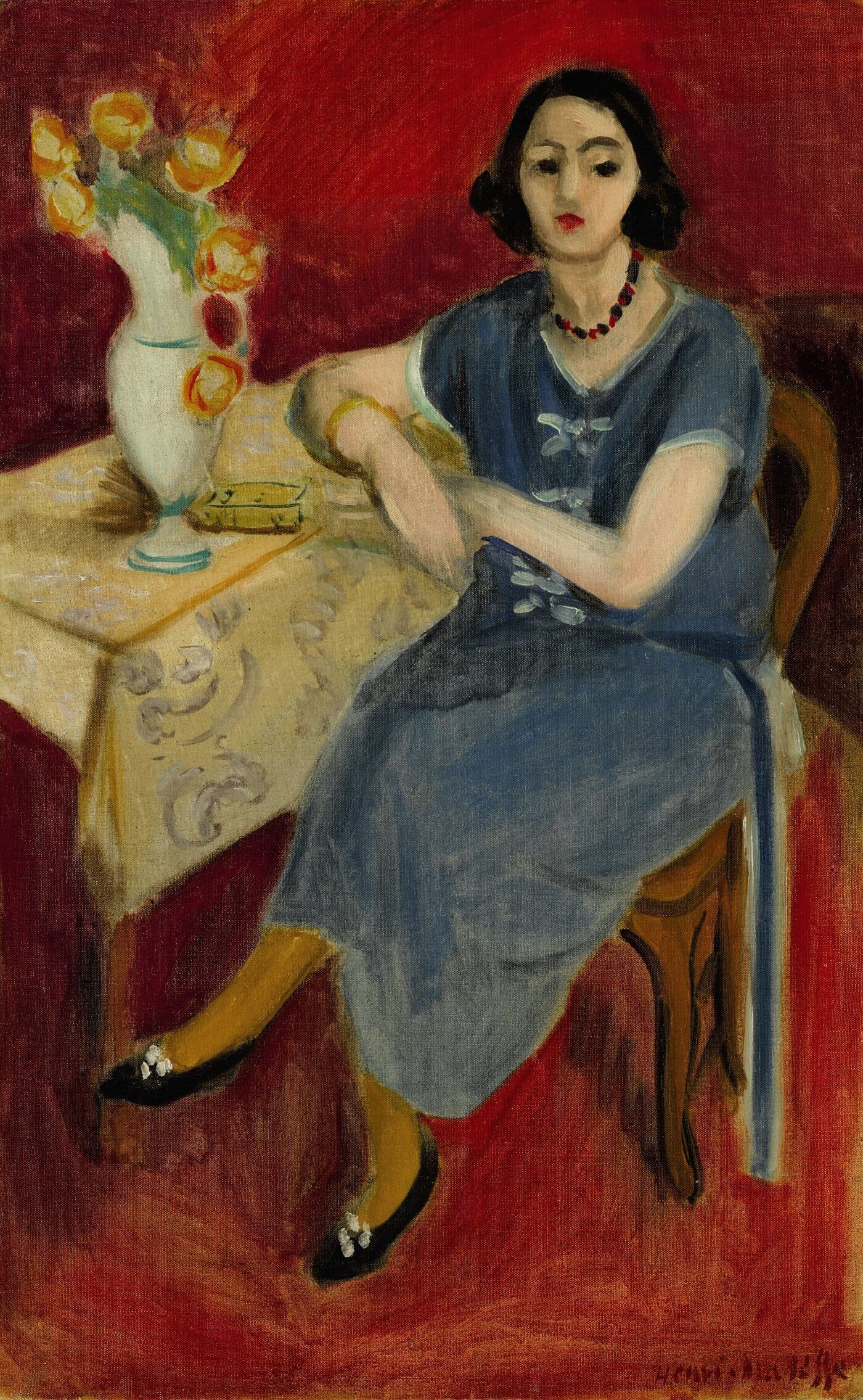 Woman in Blue at a Table